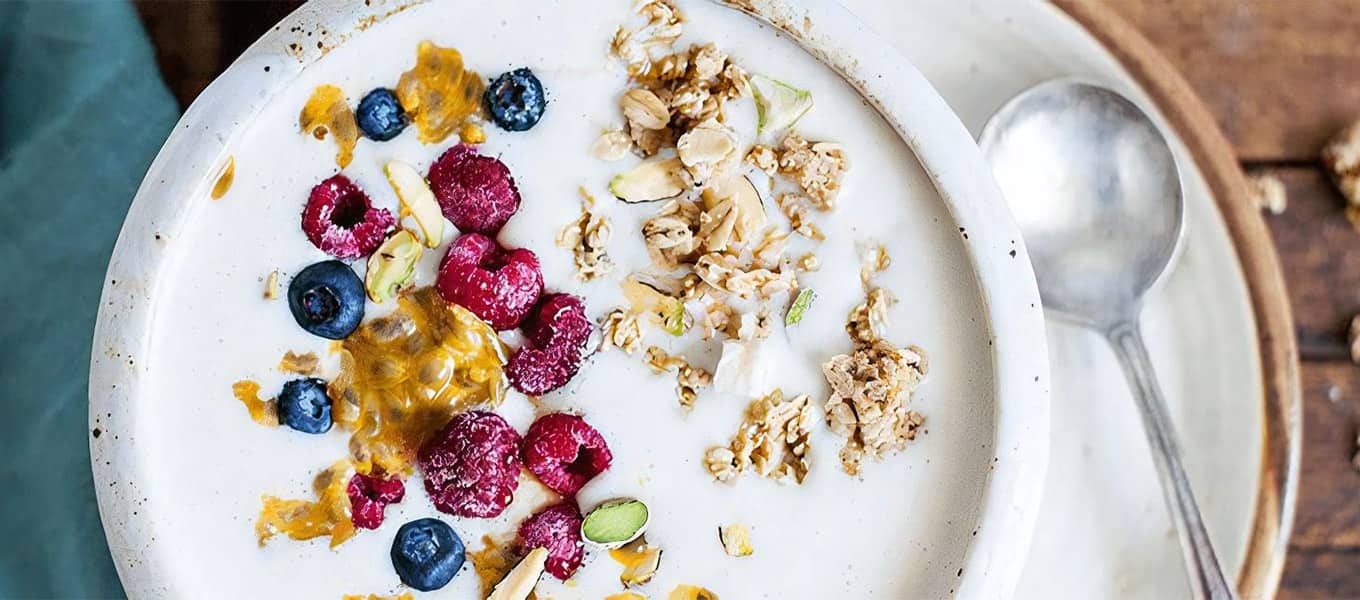 Almond, banana, vanilla yogurt and passion fruit smoothie bowl